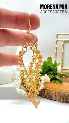 #earrings #jewelry #handmadeearrings #wirewrappedjewelry #earringsforwomen #earringstyle #chandelierearrings #earringsforwomen #dangleearrings #statementjewelry #goldearrings  #longearrings #champagneearrings #bohemianearrings #beadedearrings #handmadejewelry #giftideasforher #christmasgiftideas #momgift #elegantearrings #mothersdaygifts #birthdaygiftidea #crystalearrings #morenamiaaccessories Gold Beaded Dangle Earrings For Festive Occasions, Gold Beaded Chandelier Earrings For Gift, Gold Dangle Chandelier Earrings With Beads, Gold Chandelier Dangle Earrings With Beads, Gold Crystal Earrings With Dangling Beads For Wedding, Handmade Gold Crystal Earrings For Festive Occasions, Festive Handmade Gold Crystal Earrings, Festive Gold Beaded Chandelier Earrings, Handmade Gold Chandelier Earrings For Party