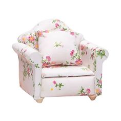 a white chair with pink and yellow flowers on the back, sitting in front of a white background