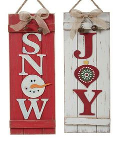 two wooden signs that say joy, snow and joy hanging from the side of each sign