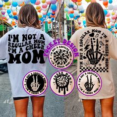 two women wearing matching shirts that say i'm not a regular mom and one with an image of a hand holding up a peace sign