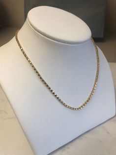 "A Beautiful 18kt Yellow Gold Lady's Open Box Chain in 24\" length. This Chain is strong and has a bright shiny plain polished finish for a sparkling look. This Chain is 2mm thick and weighs 8 grams. This item would Retail for $1,560.00" Gold Fine Jewelry Tennis Necklace For Gift, White Gold Tennis Necklace With Box Chain As Gift, Elegant Box Chain Tennis Necklace As Gift, Gift Yellow Gold Tennis Necklace With Diamond Cut, Elegant Tennis Necklace With Box Chain As Gift, Yellow Gold Diamond Cut Tennis Necklace Gift, 14k Yellow Gold Tennis Necklace Gift, Gold Tennis Necklace For Gift, Luxury Tennis Necklace With Box Chain For Gift