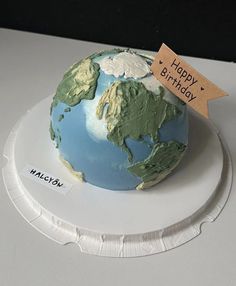 a birthday cake made to look like the earth