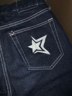 the back pocket of a pair of jeans with a white star on it's side