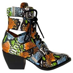 These Chloe snake print Rylee boots feature a beautiful multi-colour design, with laces at the front and a buckle as well. Straps on the side of the boots allow for a chic see through look. Heel height is approximately 3”. COLOR: Green, blue, orange, multicolour MATERIAL: Leather DATE CODE: CH30520 SIZE: 38.5 EU / 7.5 US HEEL HEIGHT: 3” EST. RETAIL: 1640.00 COMES WITH: Chloe box CONDITION: Some light scuff marks on the bottom, but overall in very good condition. Made in Italy ------------------- Orange Ankle Boots, Combat Fashion, Song Of Style, Chloe Shoes, Brown Flats, Boutique Online, Look Chic, Snake Print, Lace Up Boots