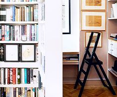 an open book shelf with books on it and a ladder leaning up against the wall