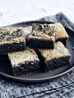 black sesame munch cake on a plate with text overlay that reads, the subversive table