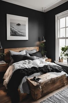 a bedroom with black walls and wooden furniture