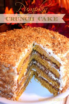 a cake that has been cut in half on a plate with the words pumpkin crunch cake above it