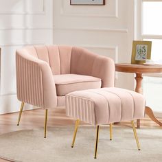 a pink chair and footstool in a living room