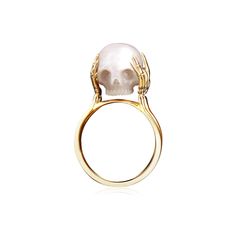 PRICES MAY VARY. Macabre Elegance: This unique ring showcases a hand-carved skull crafted from lustrous freshwater pearl, adding a touch of gothic allure to any ensemble. Precious Pearl: The 7mm freshwater pearl skull is the centerpiece, exuding a natural luminescence and timeless beauty. Intricate Metalwork: Secured by delicate golden tendrils, the pearl skull rests atop a sleek golden band, blending contemporary style with a hint of dark mystique. Versatile Accessory: Suitable for both men and women, this ring makes a bold statement, whether worn for a formal occasion or as an edgy everyday accessory. Meaningful Gift: An exquisite choice for anniversaries, weddings, or romantic gestures, this ring symbolizes eternal love with its unconventional yet captivating design. Embrace the dark an Pearl Ring Men, Skull Pearl, Pearl Skull, Pearl Wedding Ring, Gold Pearl Jewelry, Carved Skull, Pearl Rings, Promise Rings For Couples, Freshwater Pearl Ring