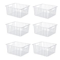 four white wire baskets sitting side by side