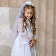 When it comes to a special occasion like a First Communion, finding the perfect dress and veil for your little girl is essential. A white First Communion dress and veil are traditional choices that symbolize purity and grace. For a classic and elegant look, consider opting for a tulle flower girl dress. The delicate fabric adds a touch of whimsy and creates a dreamy silhouette as your daughter walks down the aisle. The soft layers of tulle give the dress an ethereal feel, making it perfect for this sacred occasion. White Tutu Dress For Wedding, White Princess Tutu Dress For Confirmation, Elegant White Tutu Dress For Confirmation, White Princess Tutu Dress For First Communion, White Tulle Princess Dress For First Communion, Elegant White Tutu Dress For First Communion, Princess Tulle Wedding Dress For First Communion, Tulle Princess Wedding Dress For Confirmation, White Tulle Gown For Dress-up