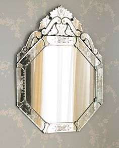 an ornate mirror hanging on the wall