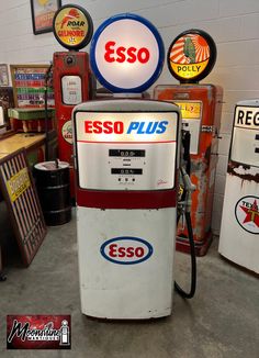 an old gas pump sitting in a garage