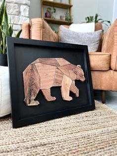 a wooden bear cut out in the shape of a bear sitting on top of a rug