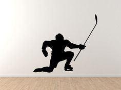 a black silhouette of a man holding a stick