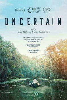 a movie poster with a man in a small boat on the water surrounded by trees