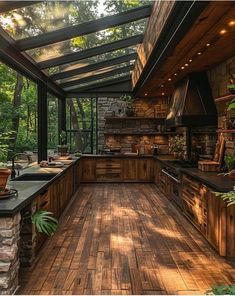 an outdoor kitchen with wooden floors and lots of greenery on the counter top area