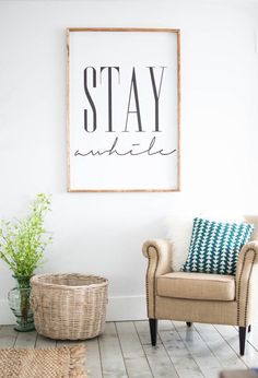 a living room with a chair and a basket on the floor