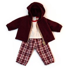 a red sweater and plaid pants with a hoodie on the top is laying down