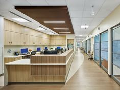 an empty office with wood and glass walls