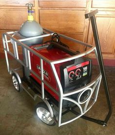 a red and silver cart with a gas tank on top