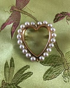 "A 14K Heart brooch-yellow gold with 20 lovely lustrous white (4.5mm) cul. pearls.  The condition is great I see no problems, safety catch works marked 14K.  Clean quality Mid Century design-picture show details.  Size 1 1/2\" by 1 1/4\", weight 6.2 grams-substantial. The heart sentimental and always soulful.  Outline of luminous pearls with graceful gold inner frame, well designed and easy to wear." Elegant Heart-shaped Wedding Brooch, Elegant Gold Brooch For Valentine's Day, Elegant Brooch For Valentine's Day, Elegant Gold Brooches For Valentine's Day, Elegant Valentine's Day Brooch Jewelry, Elegant Valentine's Day Brooch, Gold Heart-shaped Brooch For Formal Occasions, Gold Heart Brooch For Formal Occasions, Gold Heart Brooch For Formal Wear