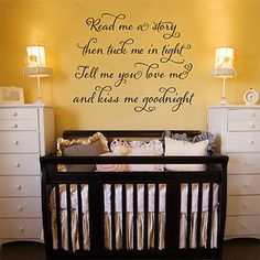 a baby crib in front of a yellow wall with the words you are my sunshine written on it