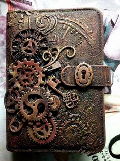 an old book with gears and keys on it