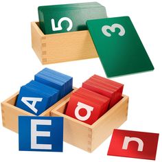 three wooden blocks with letters and numbers in them