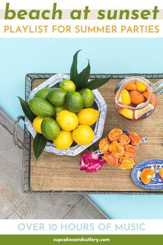 a wooden tray topped with lemons and oranges next to a bowl of fruit