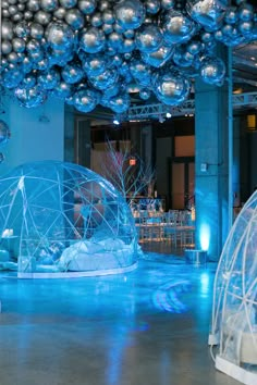 a room filled with lots of blue and silver ornaments