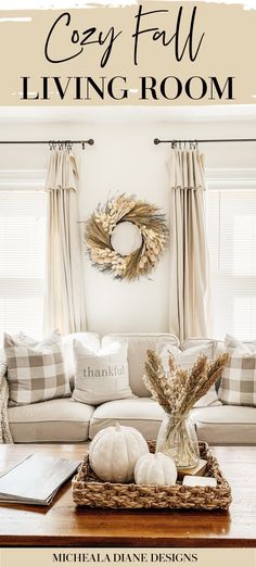 the cozy fall living room is filled with white pumpkins, wheat wreath and other decorations