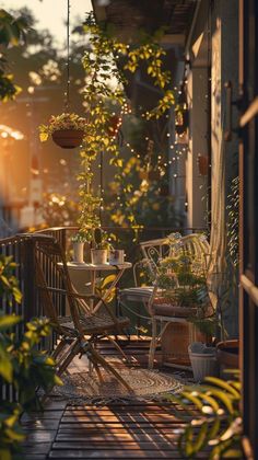 an outdoor patio with chairs, tables and potted plants on the balcony area at sunset