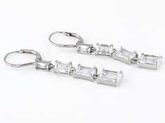 Bella Luce® white diamond simulant 7.20ctw rectangle, platinum over sterling silver earrings. Measures approximately 1.75" L x 0.13" W and have lever back backings. The diamond equivalent weight is 4.36ctw. Diamond Simulant, White Diamond, Cubic Zirconia, Sterling Silver Earrings, Platinum, Silver Earrings, Sterling Silver, Silver