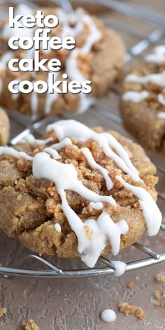 a close up of a cookie with icing on a cooling rack next to other cookies