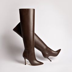 Since the very beginning, the Kate has been a runaway bestseller. So we couldn't help but add a few additional pairs to the mix, now in a super duper thigh-high silhouette. With just enough height to go over the knee, we love wearing these to make a major statement in the boot shape that's forever a favorite. Product Details: Brown Shine kid skin leather Closed pointed toe Pull up boot 3.8 inch stiletto heel Larroudé “L” logo in golden hardware Finely crafted leather sole for support, durability L Logo, Kitten Heel Boots, Platform Flats, Sandal Platform, Trending Boots, Jennifer Fisher, Super Duper, Pumps Flat, Pull Up