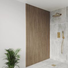 a bathroom with a shower head and wooden slats on the wall next to a potted plant