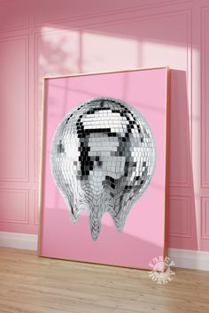 a pink room with a mirror ball in the shape of a woman's head