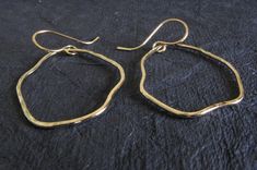 "Artisan handmade organic shape earrings. These are available in sterling silver with a couple of different finish options as well as the pictured 14k gold filled. The Details. ∞ Artisan handmade ∞ 14k gold filled or sterling silver textured drops (approx 1 1/2\" long, 1\" wide) ∞ 14k gold filled or sterling silver handmade ear hooks ∞ Approximate total length ~ 2\" ∞ Made to order Θ Allow up to 14 business days before shipment Θ ∞ Gift box included ∞ Made in the USA VISIT OUR SHOP: http://www.P Hammered Freeform Jewelry As A Gift, Hammered Freeform Jewelry For Gifts, Artisan Hammered Jewelry In Recycled Gold, Artisan Hammered Recycled Gold Jewelry, Prescott Az, Handmade Artisan, Earrings Handmade, Handmade Silver, Gold Filled