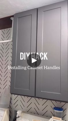 the kitchen cabinets are painted gray and have white lettering on them that reads diy track installing cabinet handles