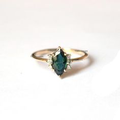 Pretty and simple Teal Sapphire diamond engagement ring. The stones can also be of other shape or kind.Gorgeous Marquise Teal Sapphire Diamond Ring, Stackable Beautiful Ring, Delicate Gemstone Ring, Wedding/Engagement Beautiful Jewelry.Product info:Main gemstone: Teal SapphireShape: Marquise Measurements: approx. 10*5 mmSide stones: white diamondsShape: roundMeasurements: approx. 1.5 mmQuality: I-J color, SI clarity, conflict-freeItem will be resized and shipped within 10 days.ITEM Will BE SHIPP Blue Marquise Engagement Ring, Marquise Gemstone Ring, Green Marquise Diamond Ring, Sapphire Solitaire Ring For Wedding, Marquise Sapphire Wedding Ring As Birthstone, Green Oval Topaz Ring For Wedding, May Birthstone Sapphire Wedding Ring In Fine Jewelry, Sapphire Wedding Ring May Birthstone Fine Jewelry, Oval Topaz Ring For Wedding, May Birthstone