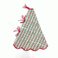 a white and red christmas tree shaped pot holder with bows on the top, sitting on a white surface