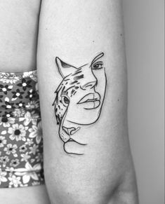 a woman with a tattoo on her arm