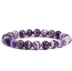 This Chevron Amethyst Gemstone Bracelet is crafted with beautiful stones carefully sourced from nature and hand-strung together with love. This bracelet provides healing benefits, balancing energy flow and promoting relaxation with its delicate yet powerful Amethyst stones.