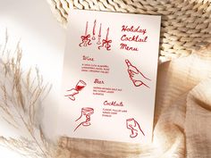 a menu with red ink on it sitting next to a straw hat and wicker basket