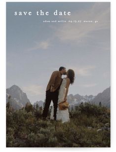 a couple kissing on top of a mountain with the words save the date above them