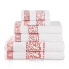 six towels stacked on top of each other with an orange and white design in the middle