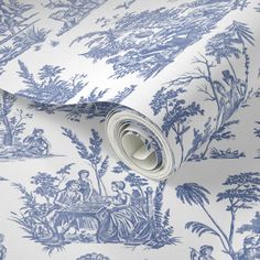 a blue and white wallpaper with toilers on it