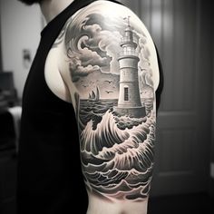 a man with a lighthouse tattoo on his arm